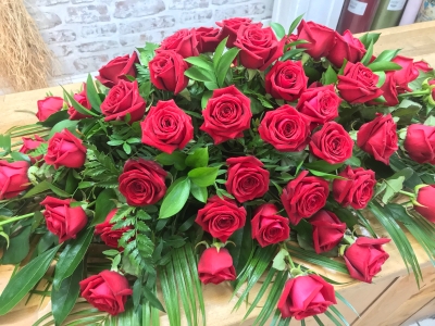 Red roses coffin spray