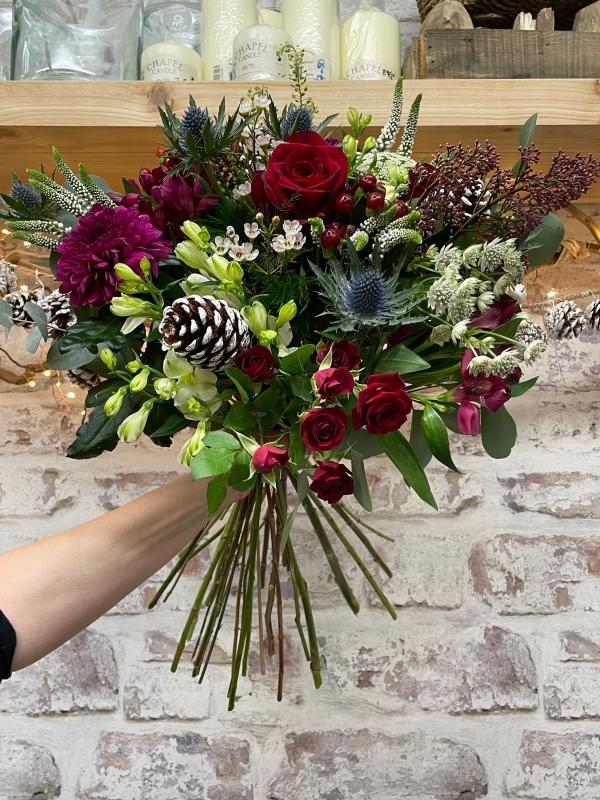 Luxurious festive hand tied bouquet, bouquet will be delivered wrapped in paper with a bow to complement.