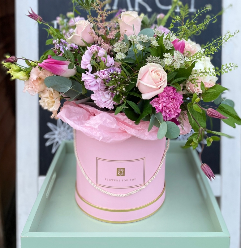 Pretty hand tied bouquet in a keepsake hat box.