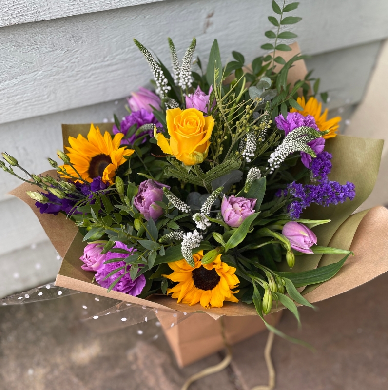 Yellow, purple and white gift box flowers.