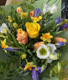 Spring hand tied bouquet in a gift box of water.