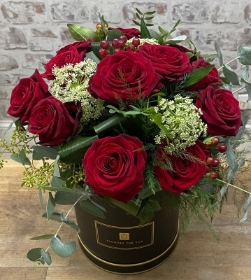 12 high quality red roses, hand tied and presented in a keepsake hat box.