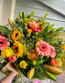 Autumn brights hand tied bouquet in water presented in a gift box.