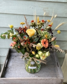 Autumnal bouquet of fresh and dried flowers in an included eco vase.