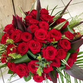 A stunning bouquet of 40 red roses in an eco vase, perfect for a ruby wedding or 40th birthday.