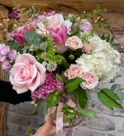 Hand tied bouquet of beautiful flowers in an included eco vase.