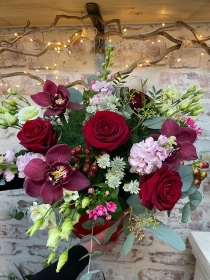 Limited edition hand tied bouquet of mixed flowers in a keepsake hat box.