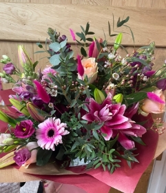 Large luxurious gift boxed bouquet in vibrant pinks and peach colours.