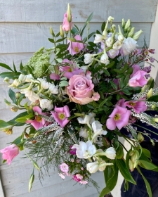 Pretty wild and wonderful bouquet presented in a gift box in water.