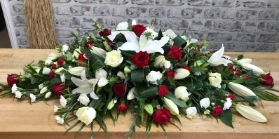 Roses and lilies double ended spray with a rose colour of your choice.