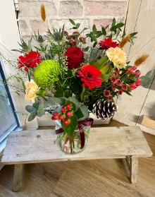 Stylish, festive hand tied flowers in an included eco vase.
