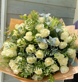 The show stopper! 48 stunning ivory roses presented in a gift box in water.